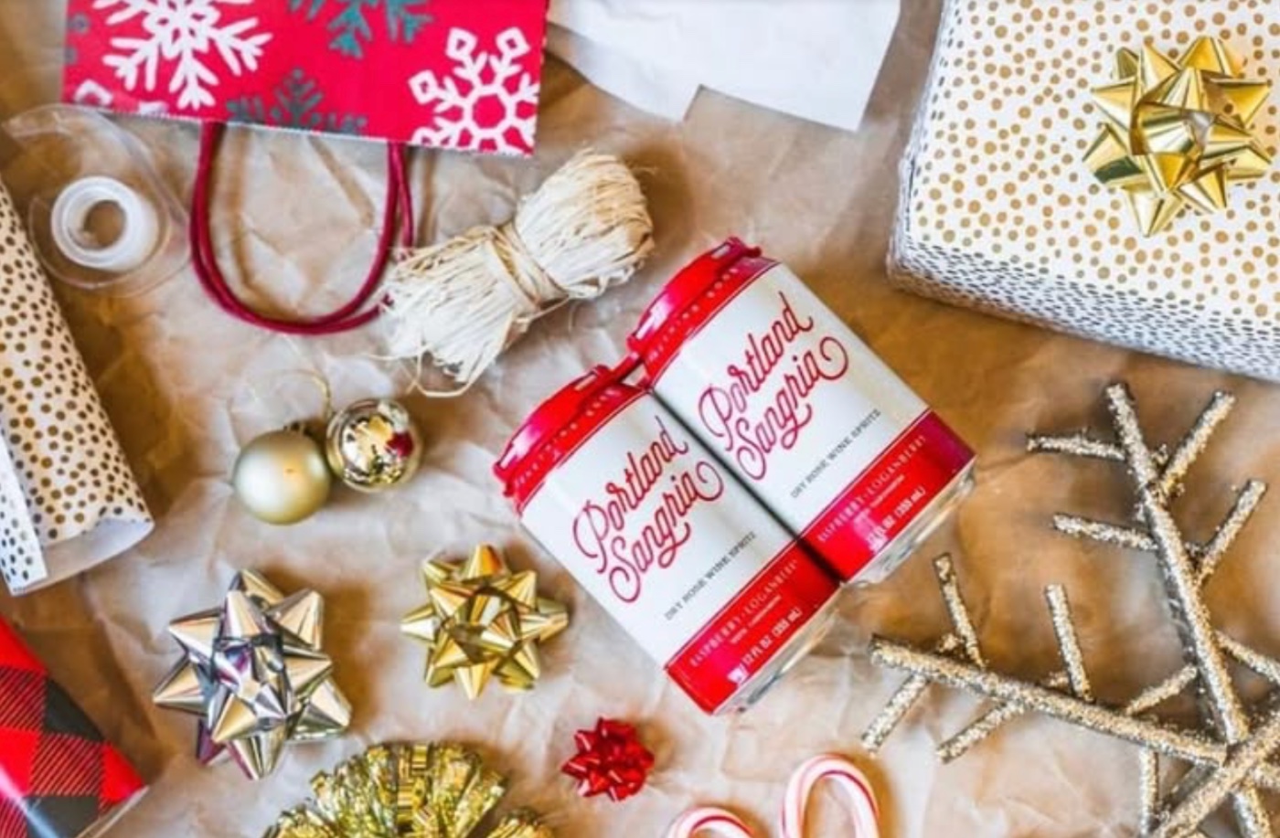 A two-pack of Portland Sangria wrapped among ribbons, bows and ornaments